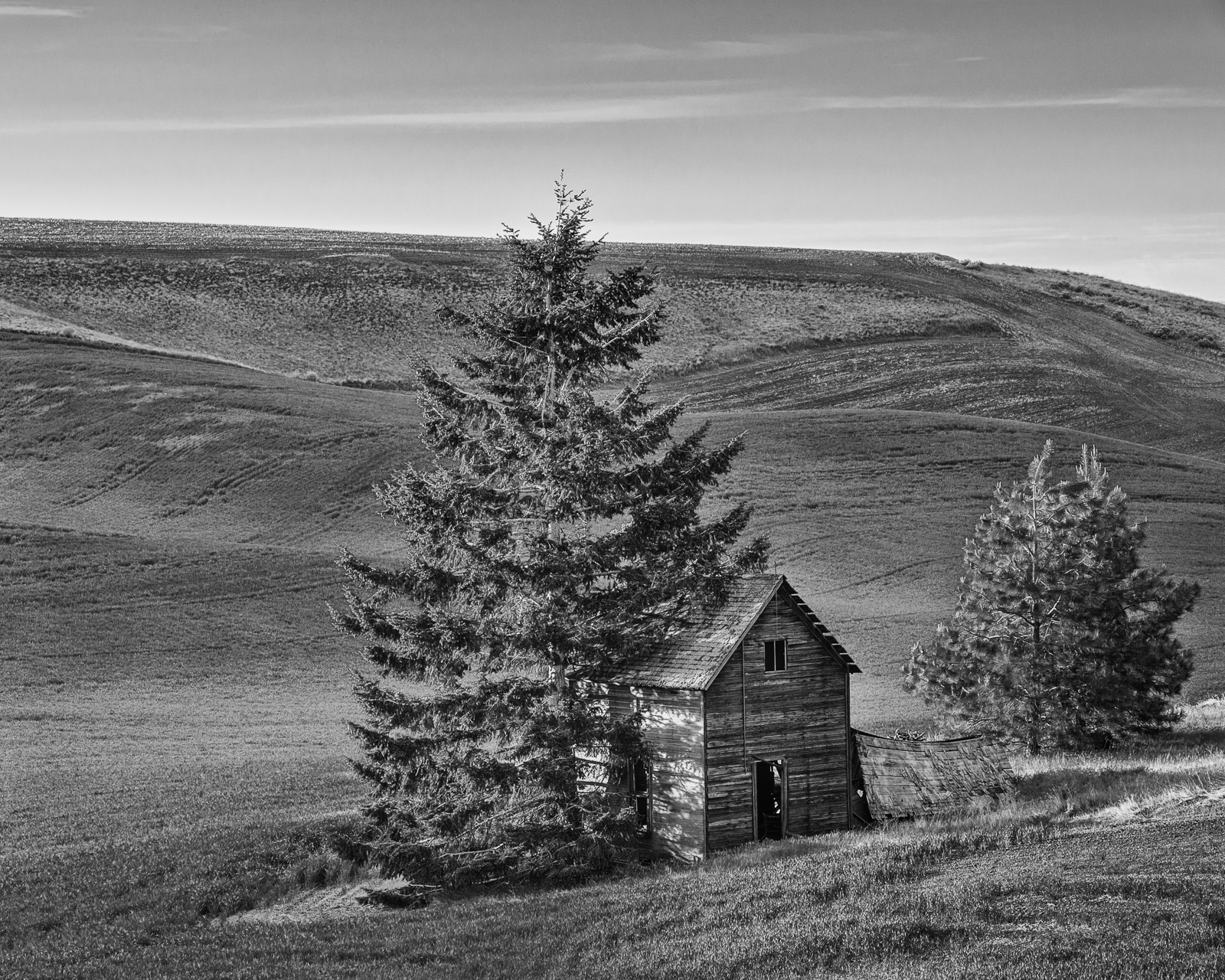 A black and white photograph of old abandoned house on Road O NW in rural Douglas County, Washington.