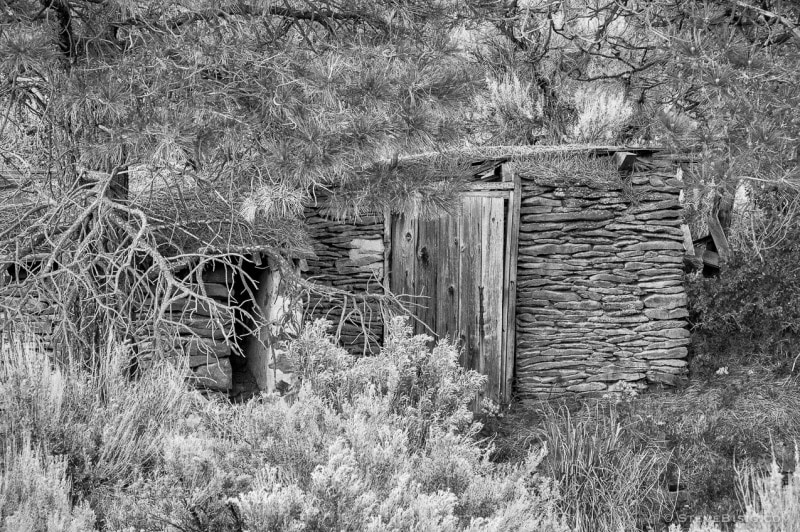 A black and white photograph of an old root cellar in Alstown, Washington.