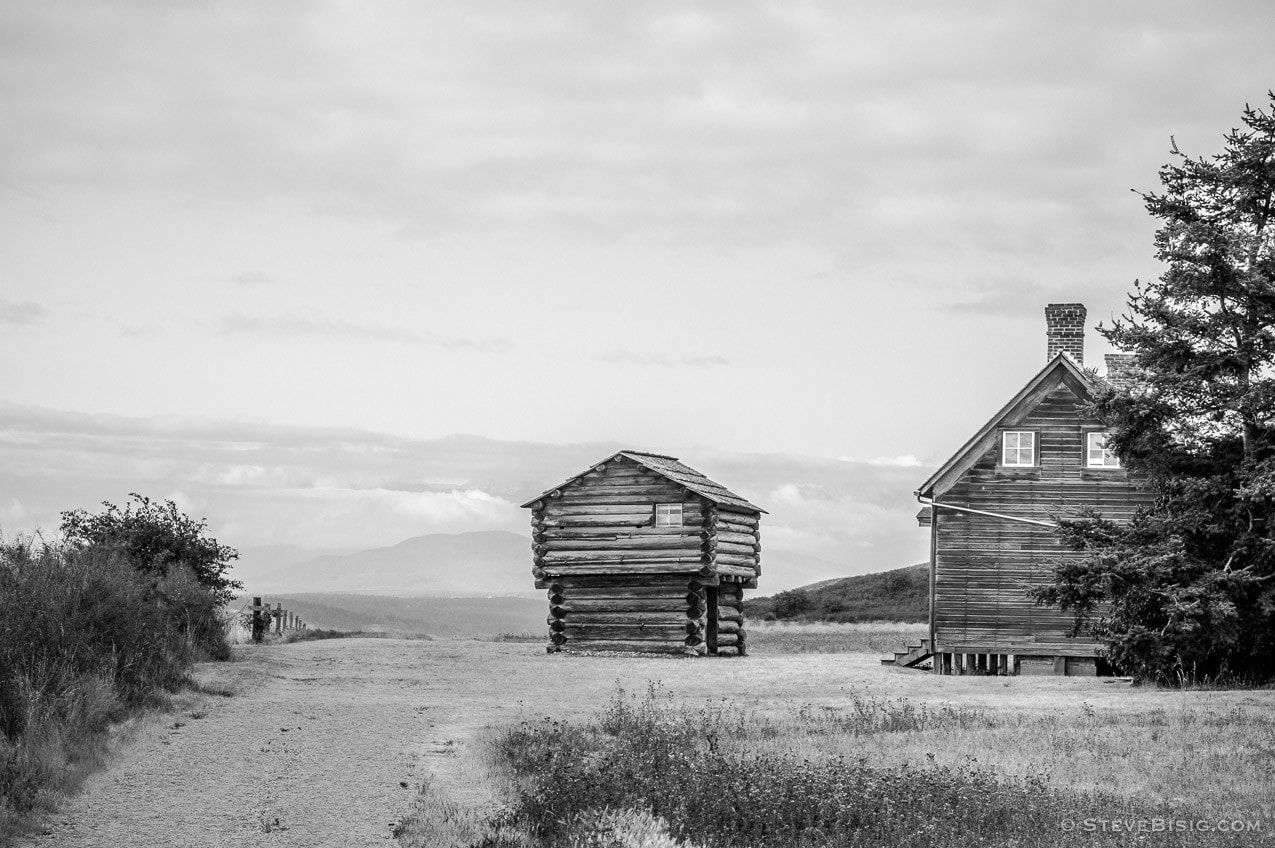 A black and white photograph of the Jacob Ebey's home and blockhouse on Whidbey Island near Coupeville, Washington.