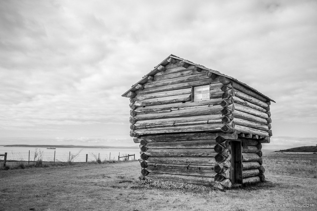 A black and white fine art photograph of the blockhouse near the home of Jacob Ebey on Whidbey Island near Coupeville, Washington.