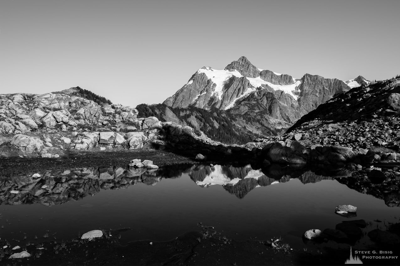 A fine art black and white landscape photograph of Mount Shuksan as viewed from Artist Point near Mount Baker Ski Area, Washington.