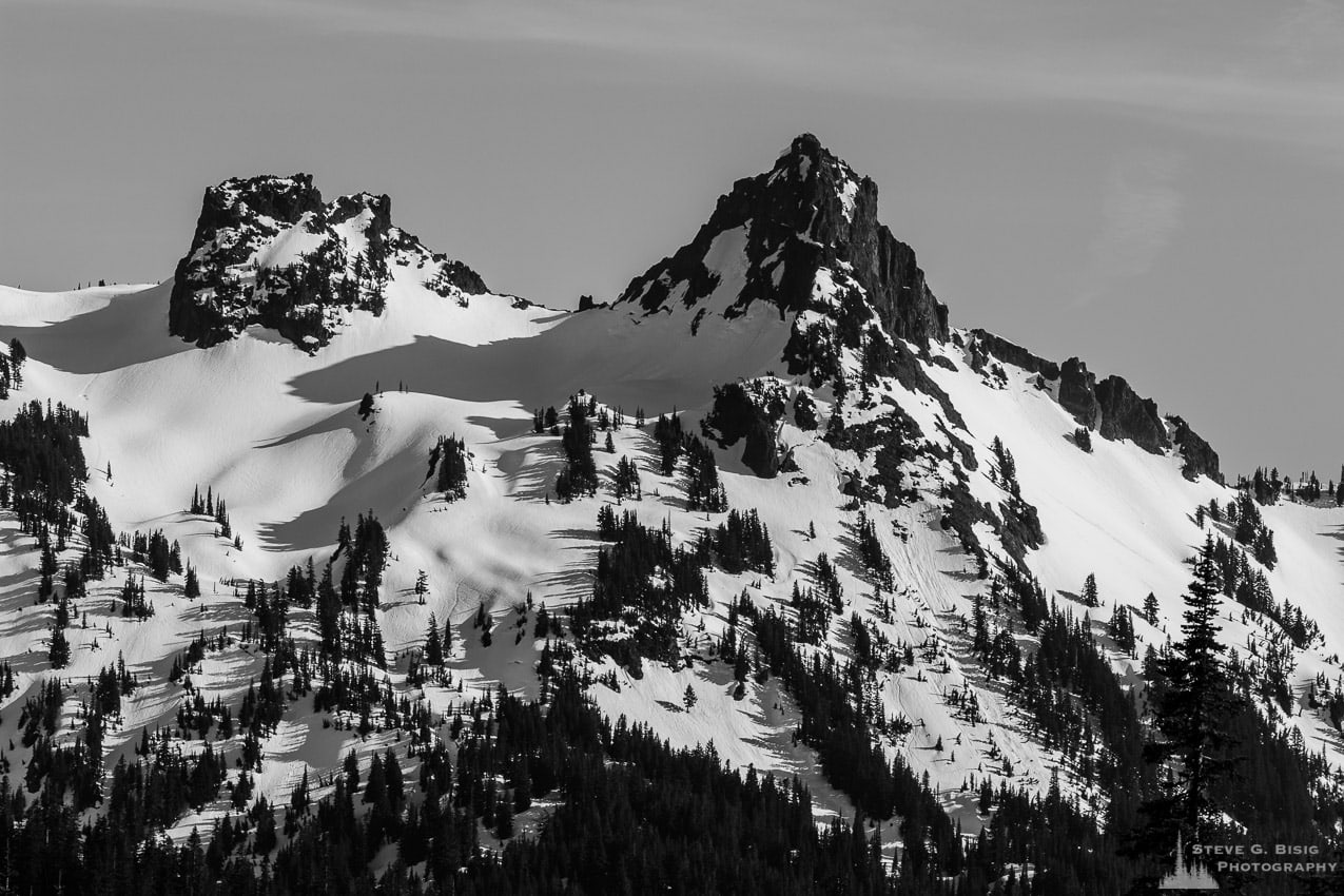 A black and white photograph of Pinnacle Peak on a sunny early Spring day as viewed from the Paradise area of Mount Rainier National Park, Washington.