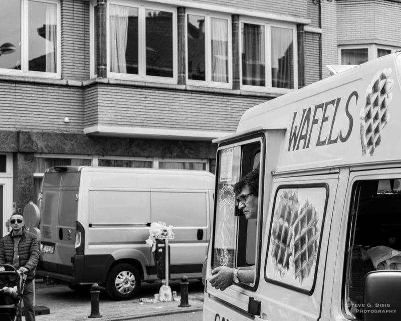 One of a series of black and white photographs from the 2018 Grande Braderie D'Ixelles sidewalk sale and street festival in Brussels, Belgium.