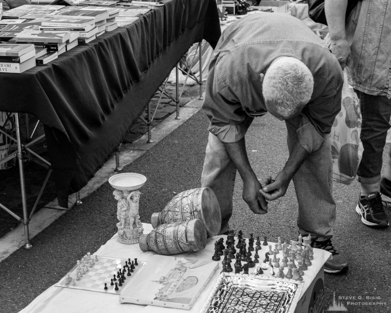 One of a series of black and white photographs from the 2018 Grande Braderie D'Ixelles sidewalk sale and street festival in Brussels, Belgium.