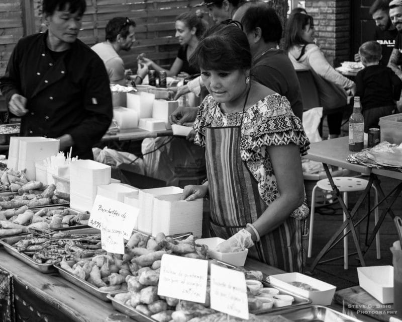 One of a series of black and white photographs from the 2018 Grande Braderie D'Ixelles sidewalk sale and street festival in Brussels, Belgium.