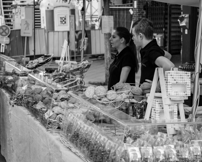 One of a series of black and white photographs from the 2018 Grande Braderie D'Ixelles sidewalk sale and street festival in Brussels, Belgium.