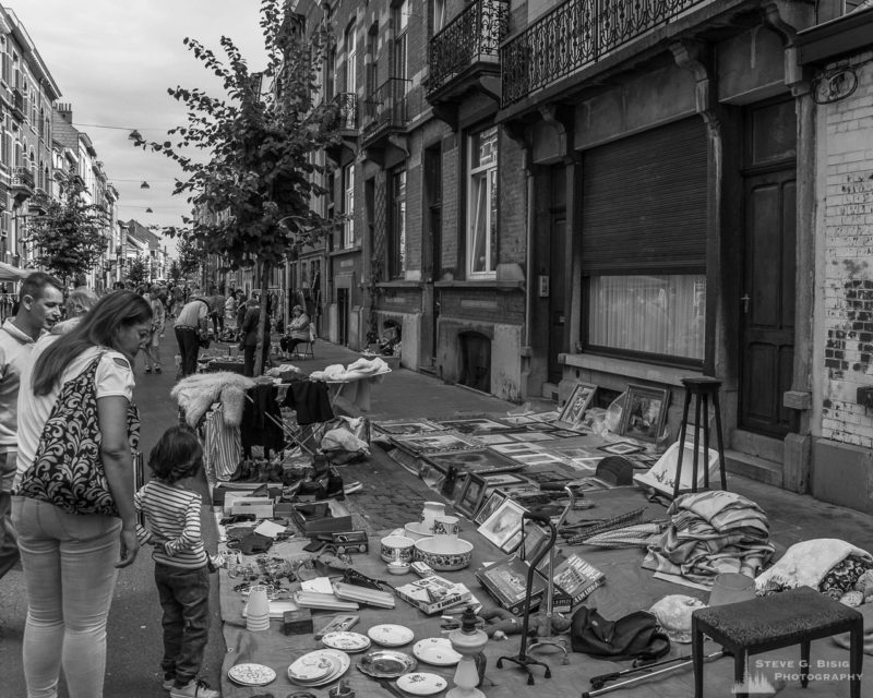 One of a series of black and white photographs from the 2018 Grande Braderie D'Ixelles sidewalk sale and street festival in Brussels, Belgium.