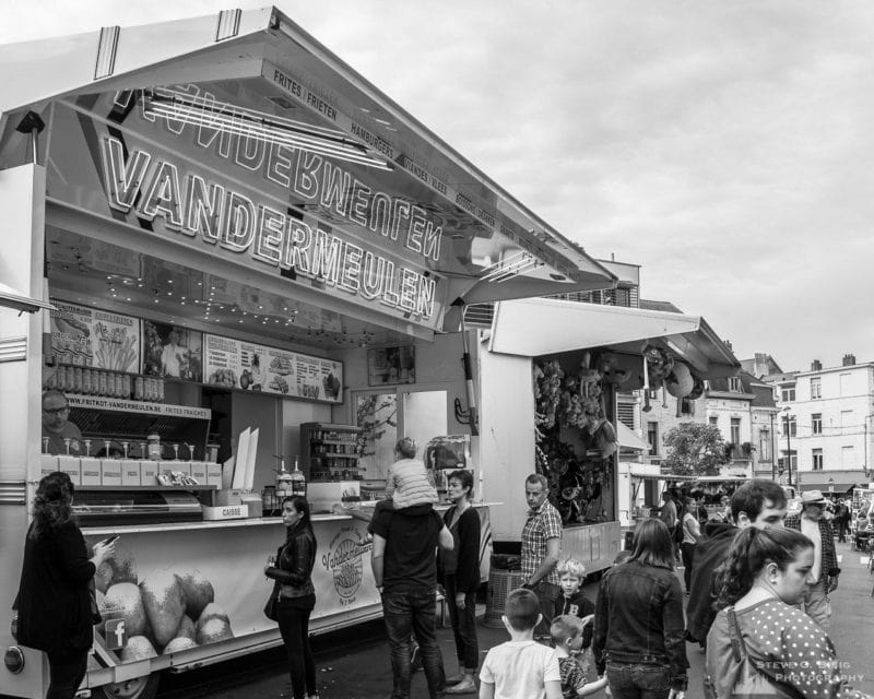 One of a series of black and white photographs from the 2018 Grande Braderie D'Ixelles sidewalk sale and street festival in Brussels, Belgium.