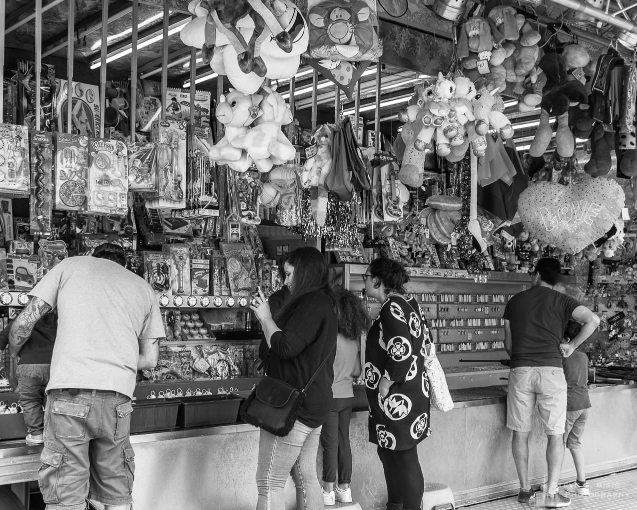 Photo 9/32 of a series of black and white photographs from the 2018 Grande Braderie D'Ixelles sidewalk sale and street festival in Brussels, Belgium.