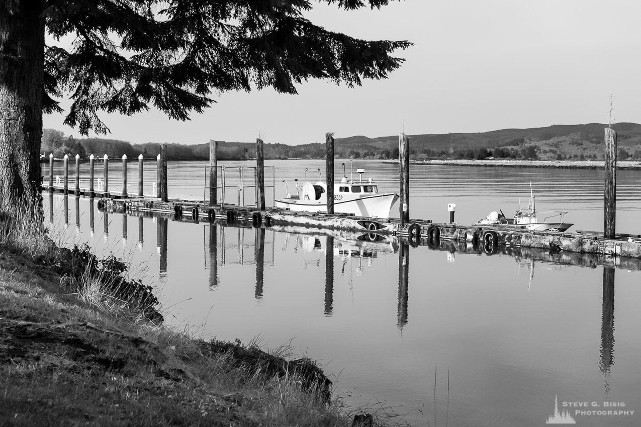 One of a series of black and white photographs captured along the banks of the Willapa River in downtown South Bend, Washington.