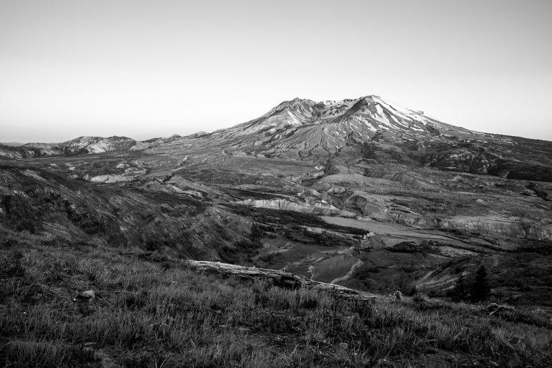 A black and white landscape photograph of Mount Saint Helens during a spring sunset as seen from the Johnston Ridge Observatory, Washington.