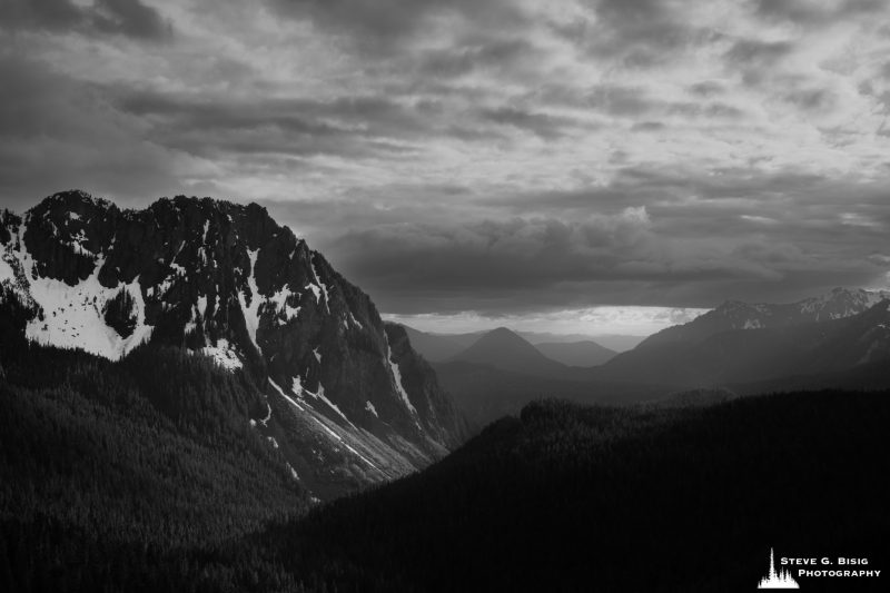 A black and white landscape photograph of the Nisqually River Valley as viewed from the Inspiration Point Overlook at Mt. Rainier National Park, Washington.