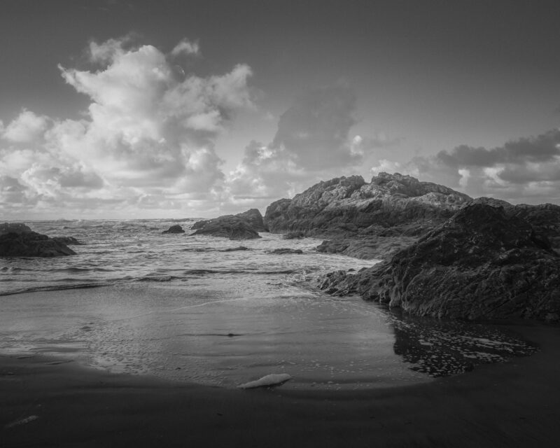 Picture yourself standing on the rocky beach at Beards Hollow, Washington, gazing out at the vast expanse of the ocean. The contrast between the smallness of mankind and the grandeur of the natural world creates a sense of both awe and humility.