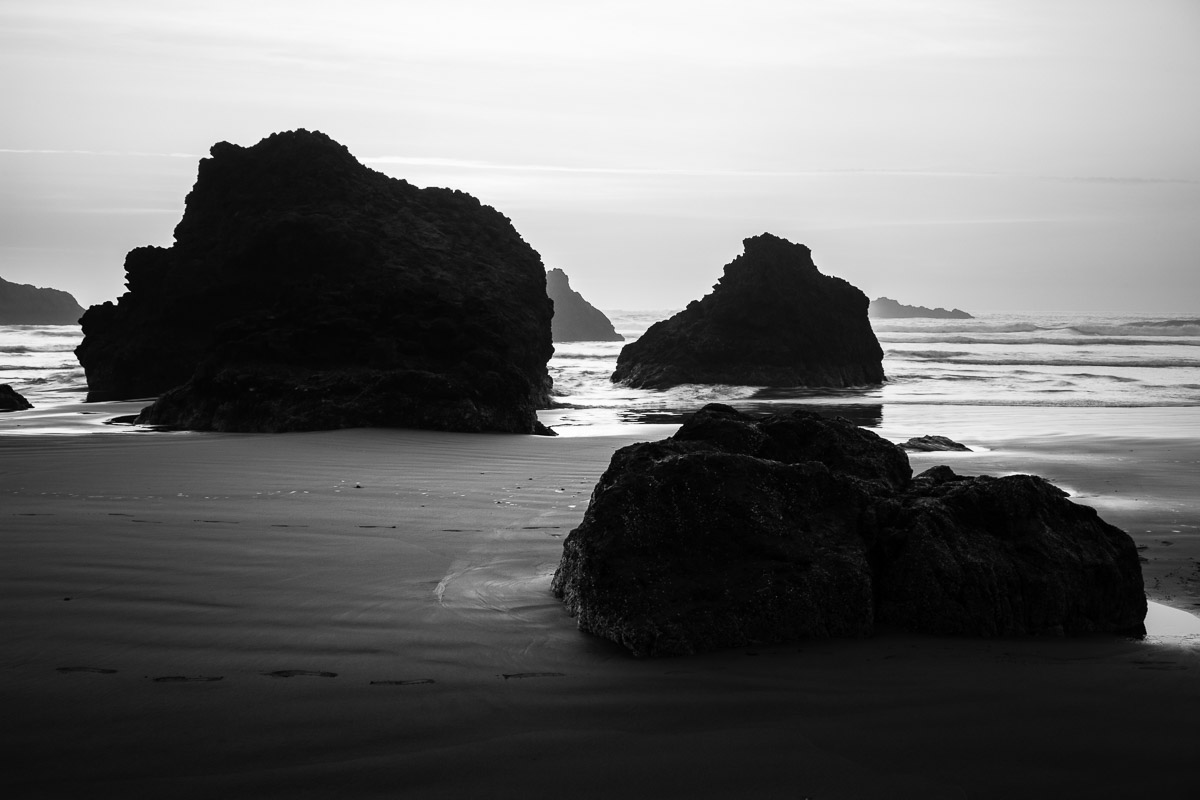 A black and white landscape photograph of the sea stacks at Hunters Cove along US101 near Gold Beach, Oregon.