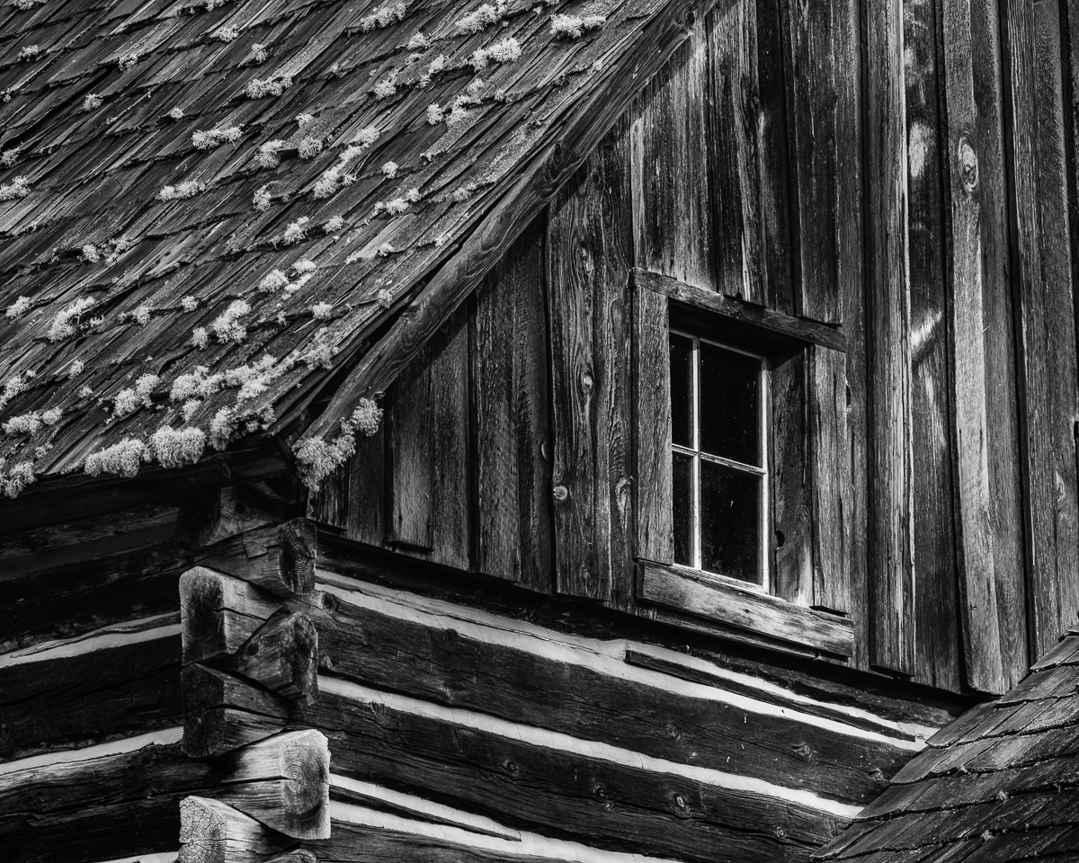 Discover the allure of this black-and-white photograph showcasing the historic Whitcomb-Cole Log House near Glenwood, Washington. The intricate textures of the weathered wood invite contemplation, revealing stories etched in each grain. This piece offers a moment of reflection, making it a perfect addition to any space seeking tranquility and rustic charm.