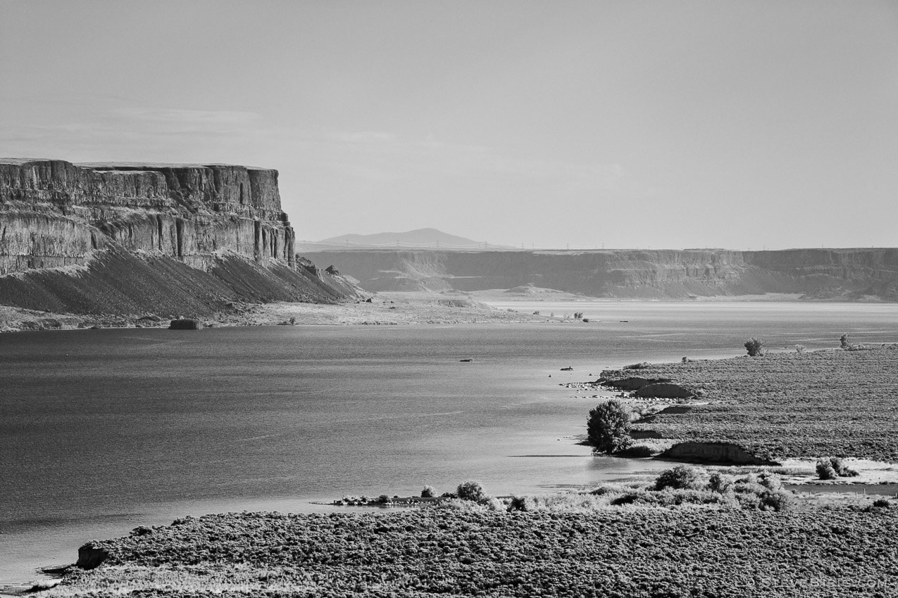 A black and white landscape photograph overlooking Grand Coulee and Banks Lake in Washington State.