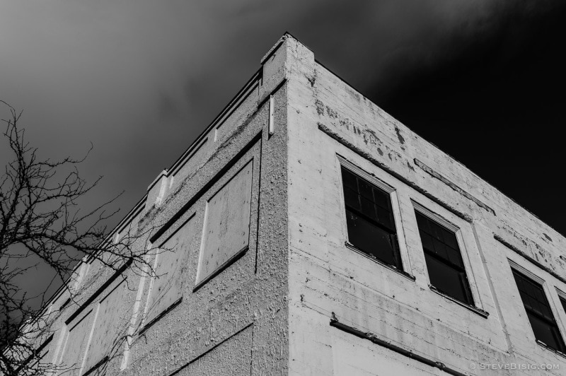 A black and white photograph of the corner of an old building in the downtown historic district of Ellensburg, Washington.