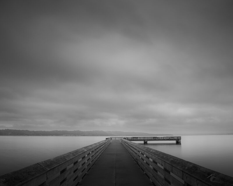 A black and photo of the Dash Point Pier overlooking the Puget Sound, Tacoma, Washington.