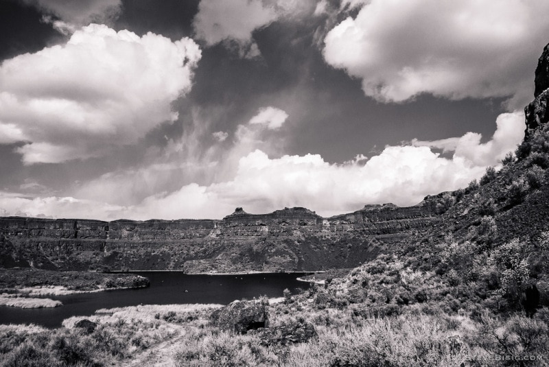 A black and white photograph of Dry Falls, in the Upper Grand Coulee in Washington.