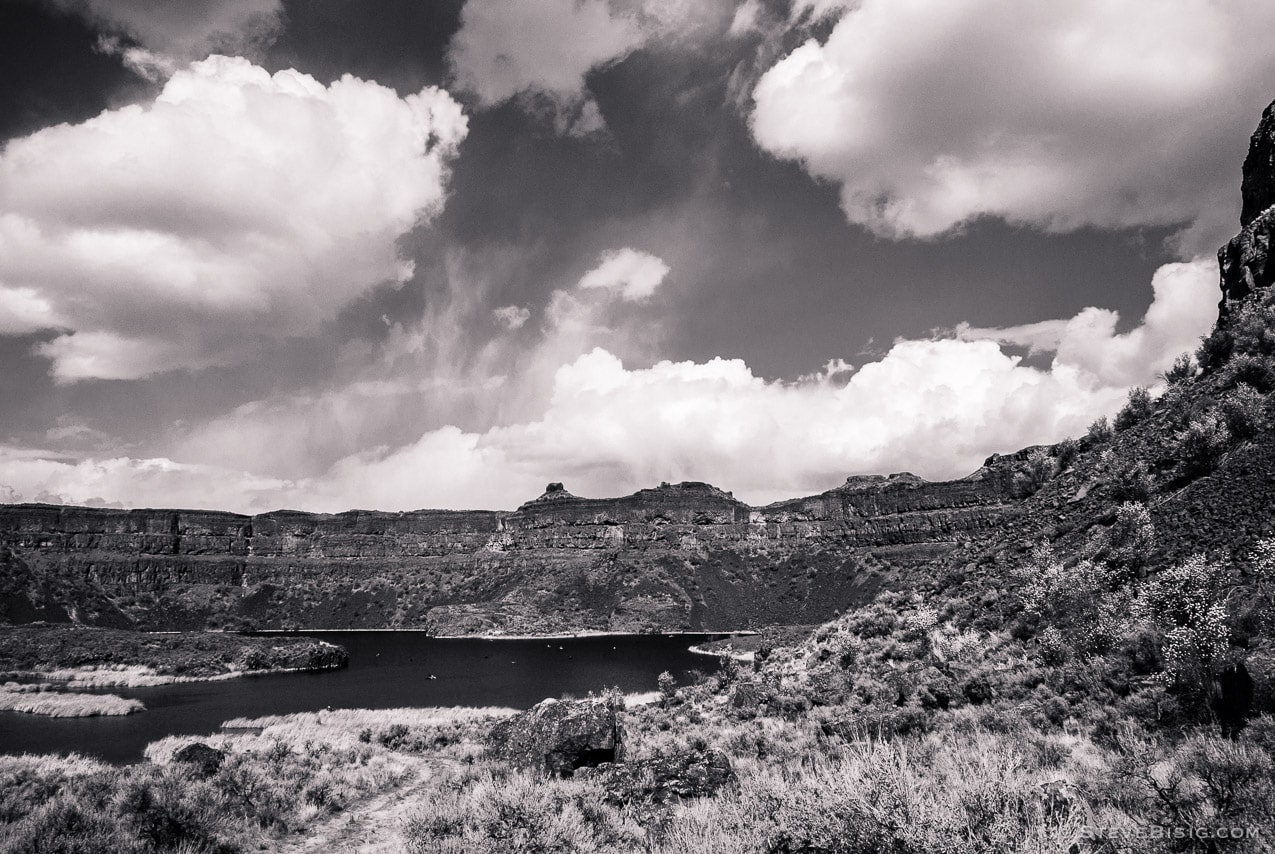 A black and white photograph of Dry Falls in the Upper Grand Coulee in Washington. 