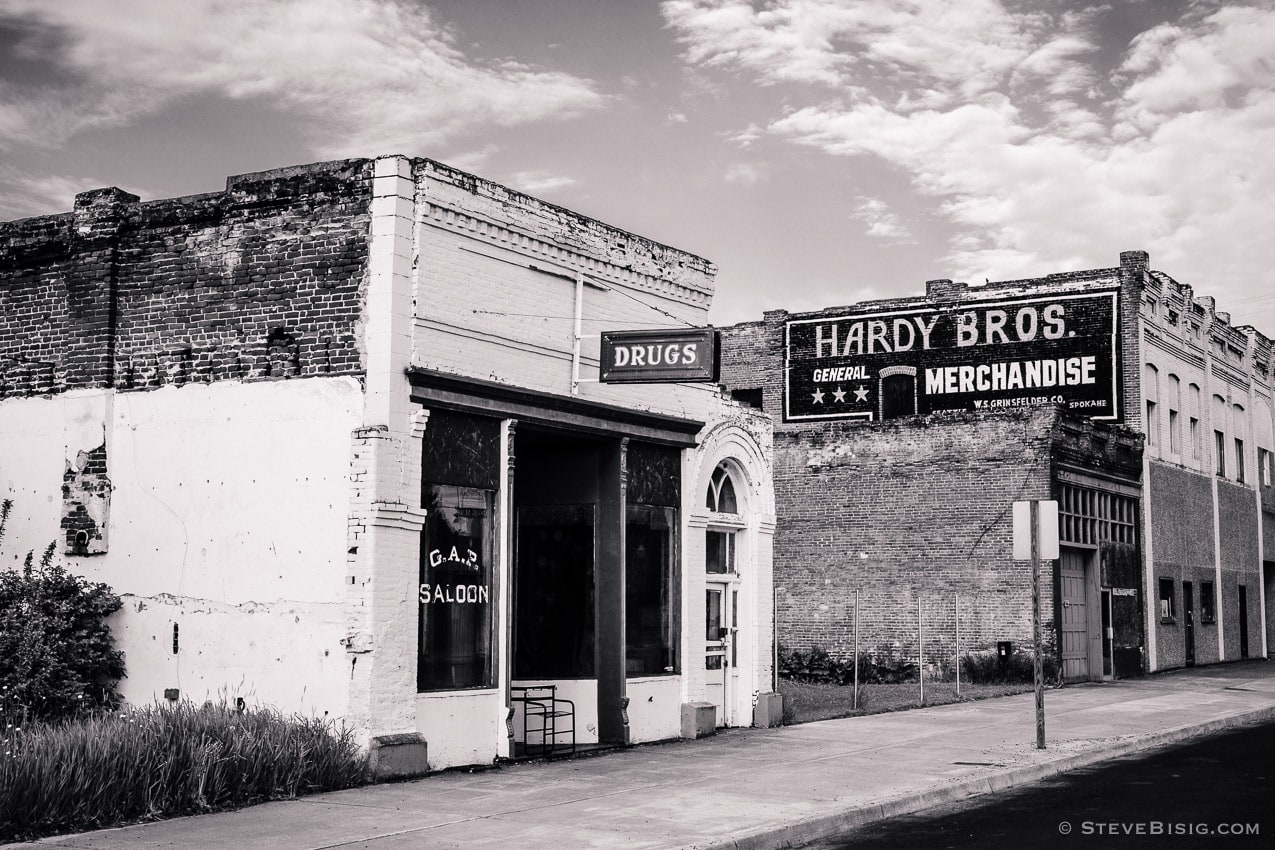 A black and white photograph of a portion of downtown Oaksdale, Washington. 