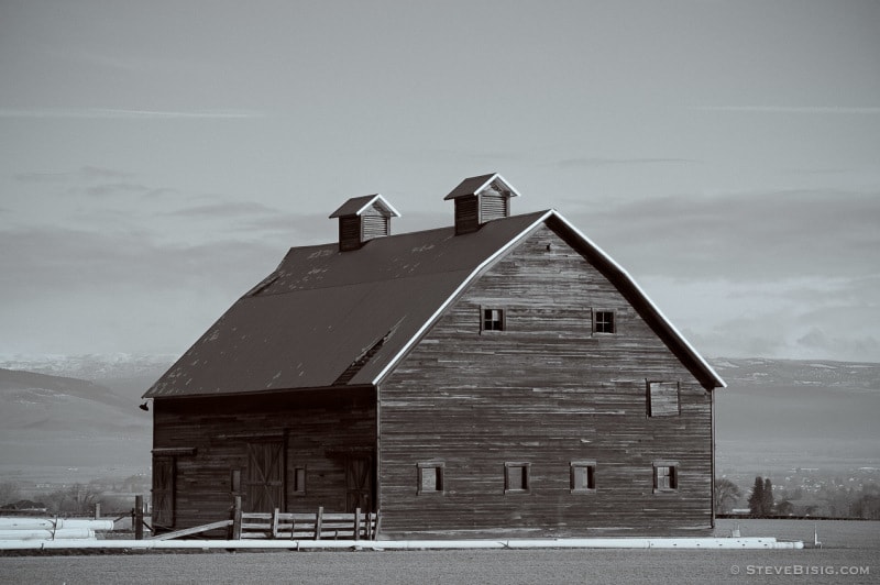 A black and white photograph of an old Barn near Manastash Road and Strande Road near Ellensburg, Washington.