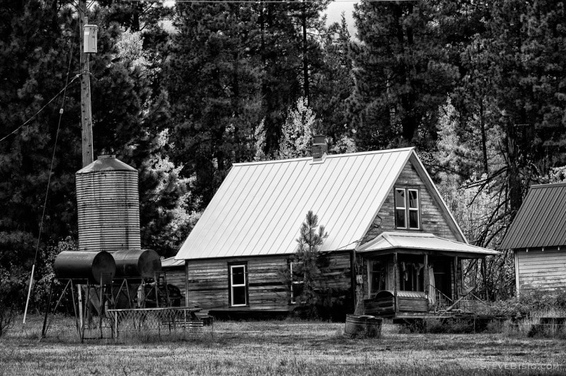 A black and white photograph of an old farmhouse in rural Kittitas County near Cle Elum, Washington.