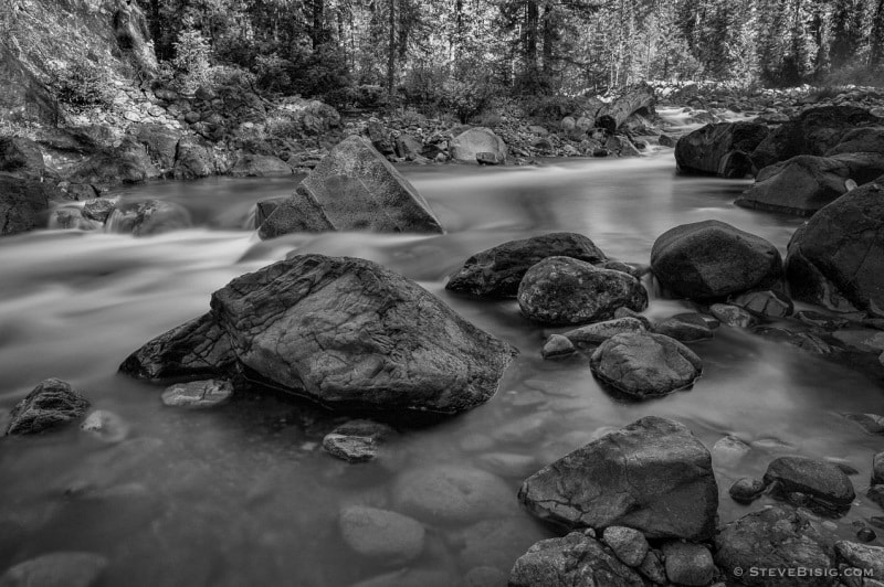 A black and white fine art nature photograph of the Cle Elum River near Salmon La Sac, Washington.