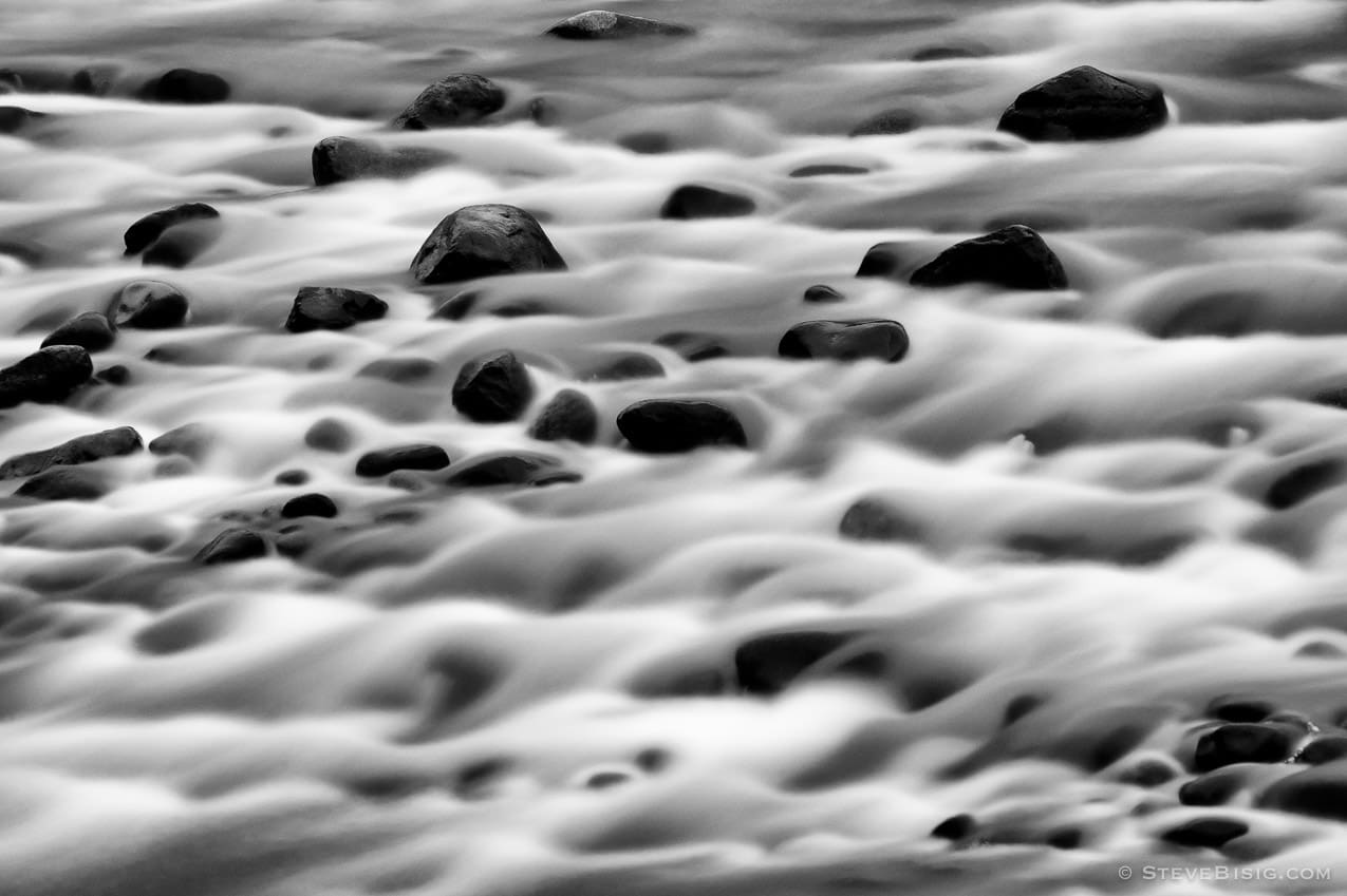 A black and white, long exposure  photograph of the  White River at the Federation Forest State Park, in King County, near Greenwater, Washington.